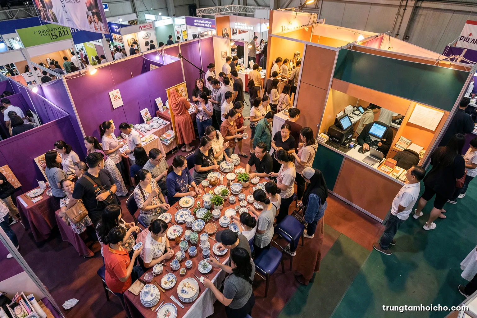 High angle view of a busy weekend consumer fair stall with Vietnamese families browsing ceramic tableware, a cashier counter at the side, warm afternoon light, terracotta and teal palette